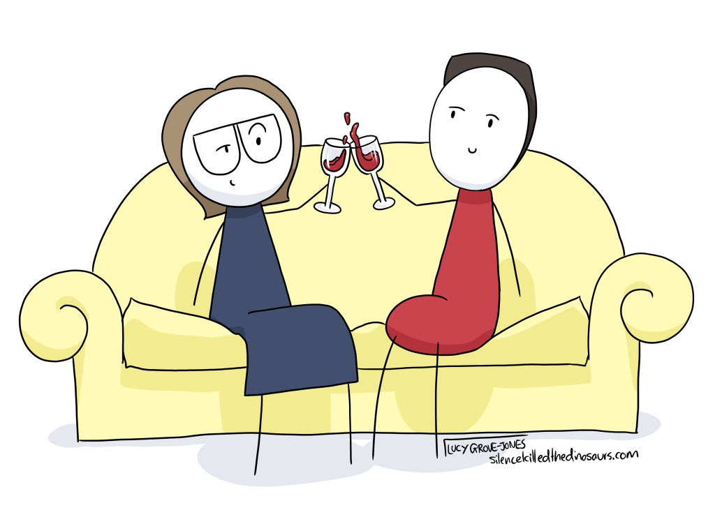 Me and my partner sitting on the couch drinking wine.