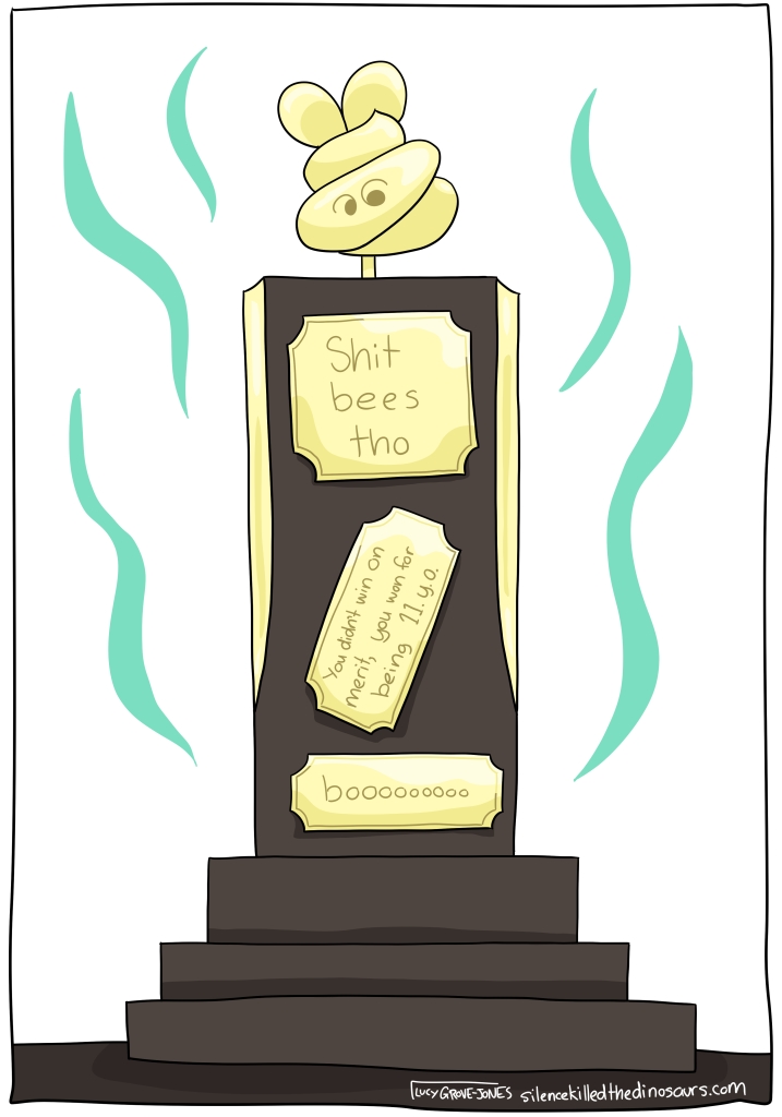 A brown trophy with a golden shit bee on top. Plaques say: "Shit bees tho", "you didn't win on merit, you won for being 11.y.o.", and "boooooo" There are stink lines radiating from the trophy